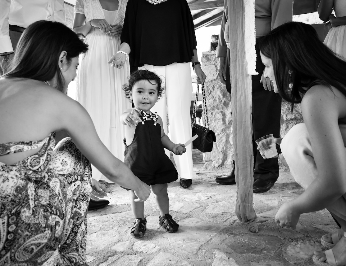 Happy family moments with a baby boy after a baptism party in Argolis.