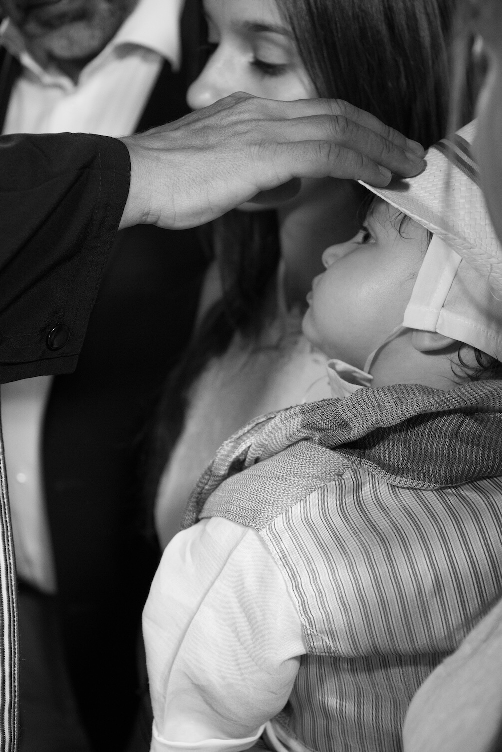 A meaningful moment captured during a holy baptism in Nafplio.
