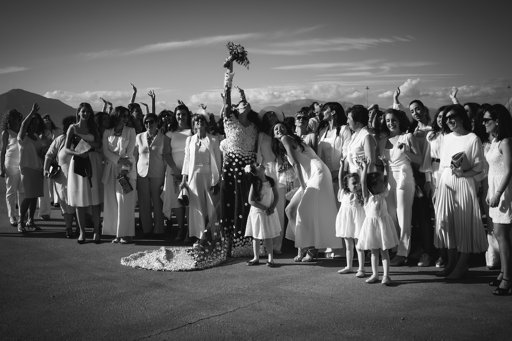 A smiling bride with her loved ones in the Peloponnese.