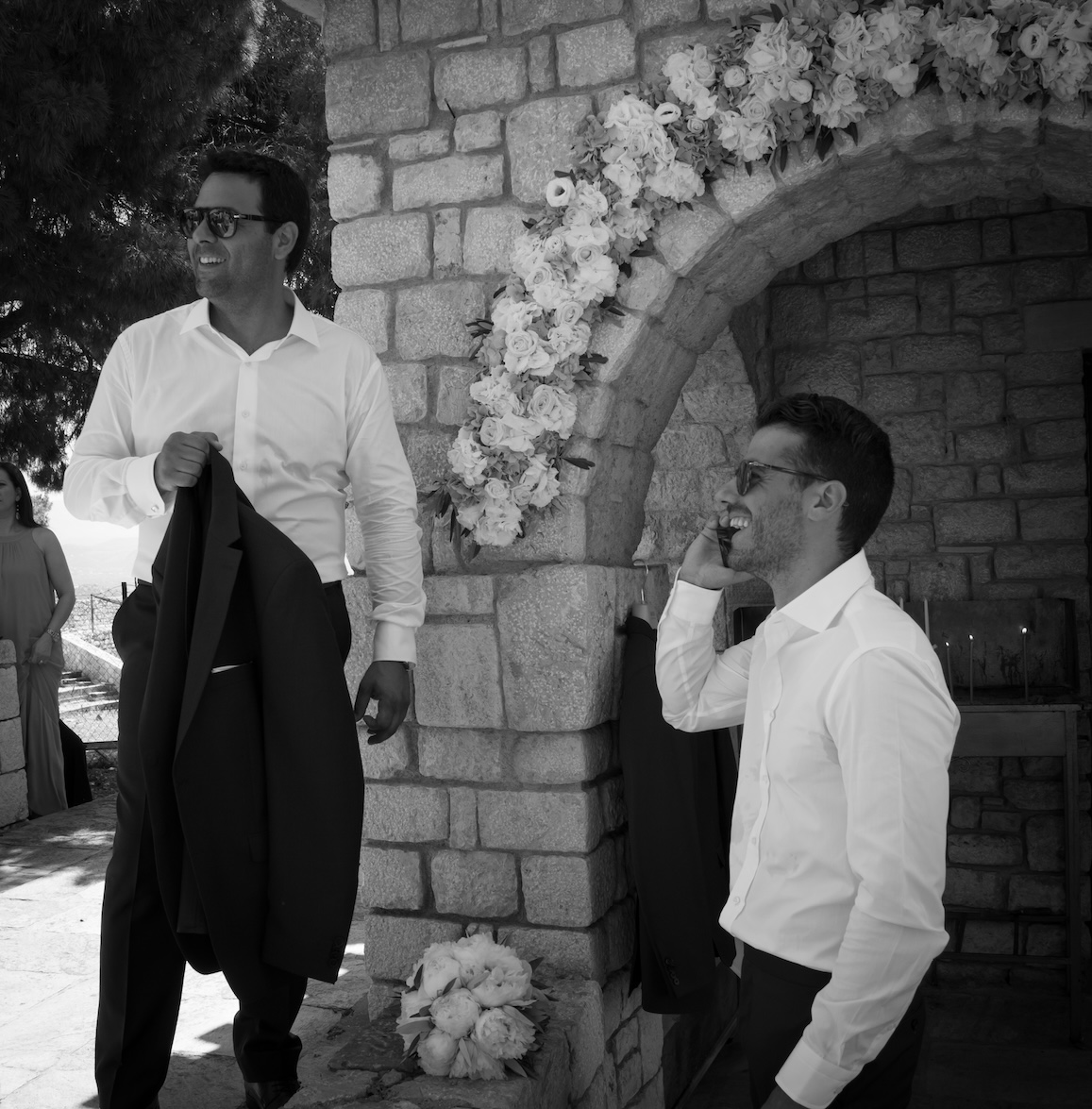 A groom and his best man laughing together.
