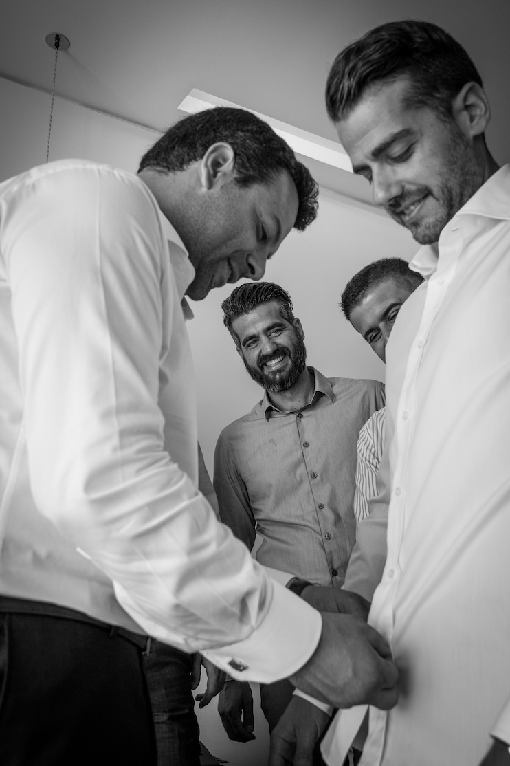 A groom getting ready with his friends for a wedding in Nafplio.
