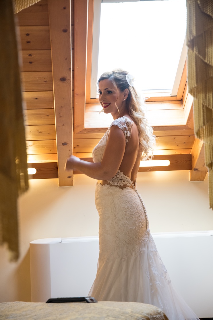 A happy bride at her wedding location in the Peloponnese.